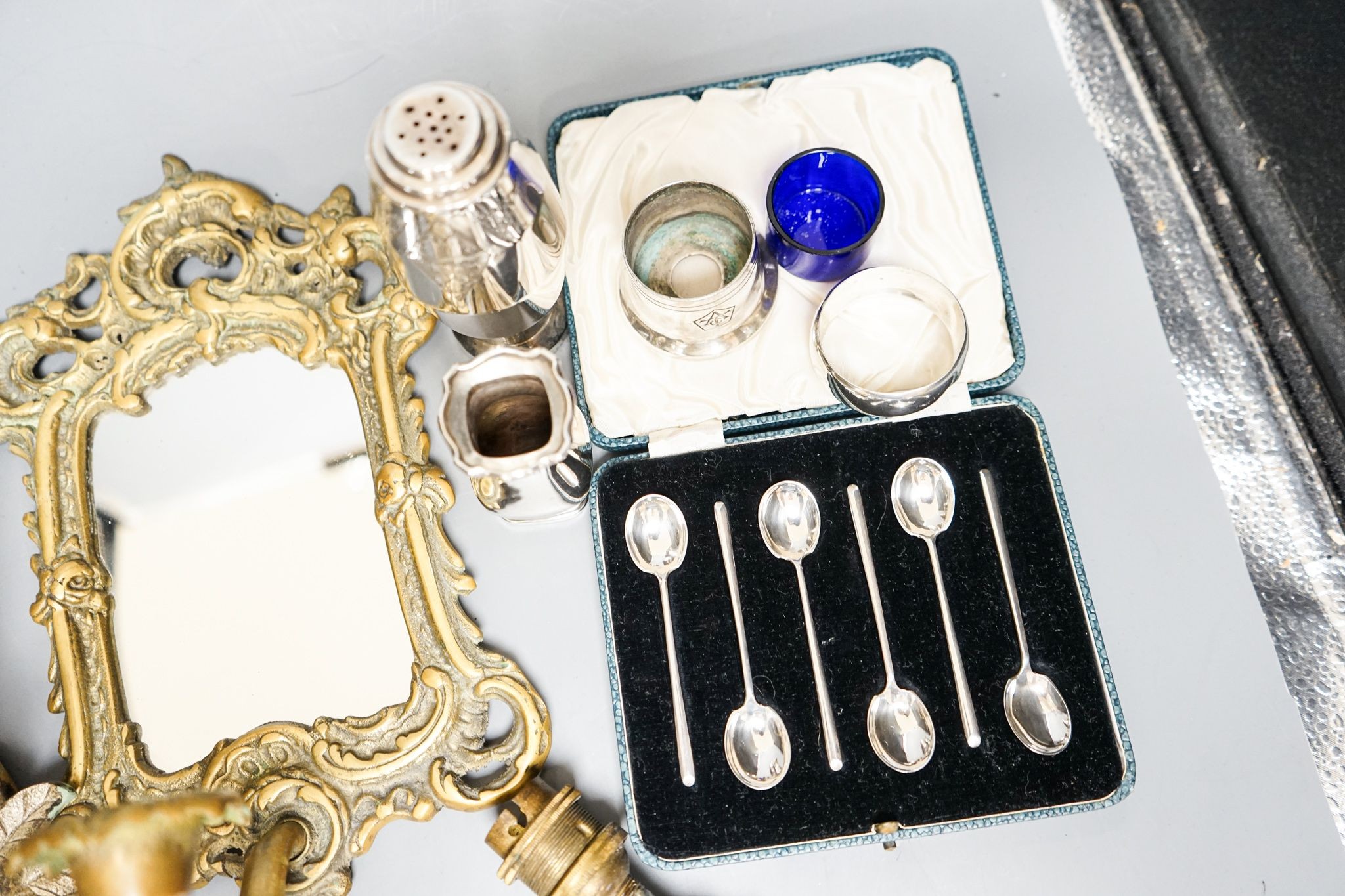 A pair of silver cruets and boxed spoons, various plate and a pair of wall mirrors and a glass wall light
